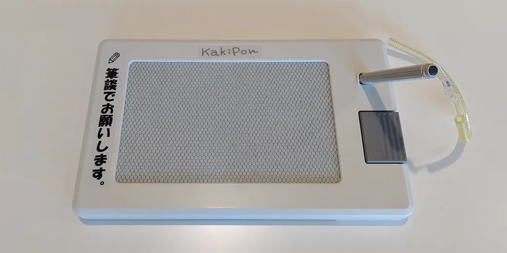 Photo : White tablet-sized communication board